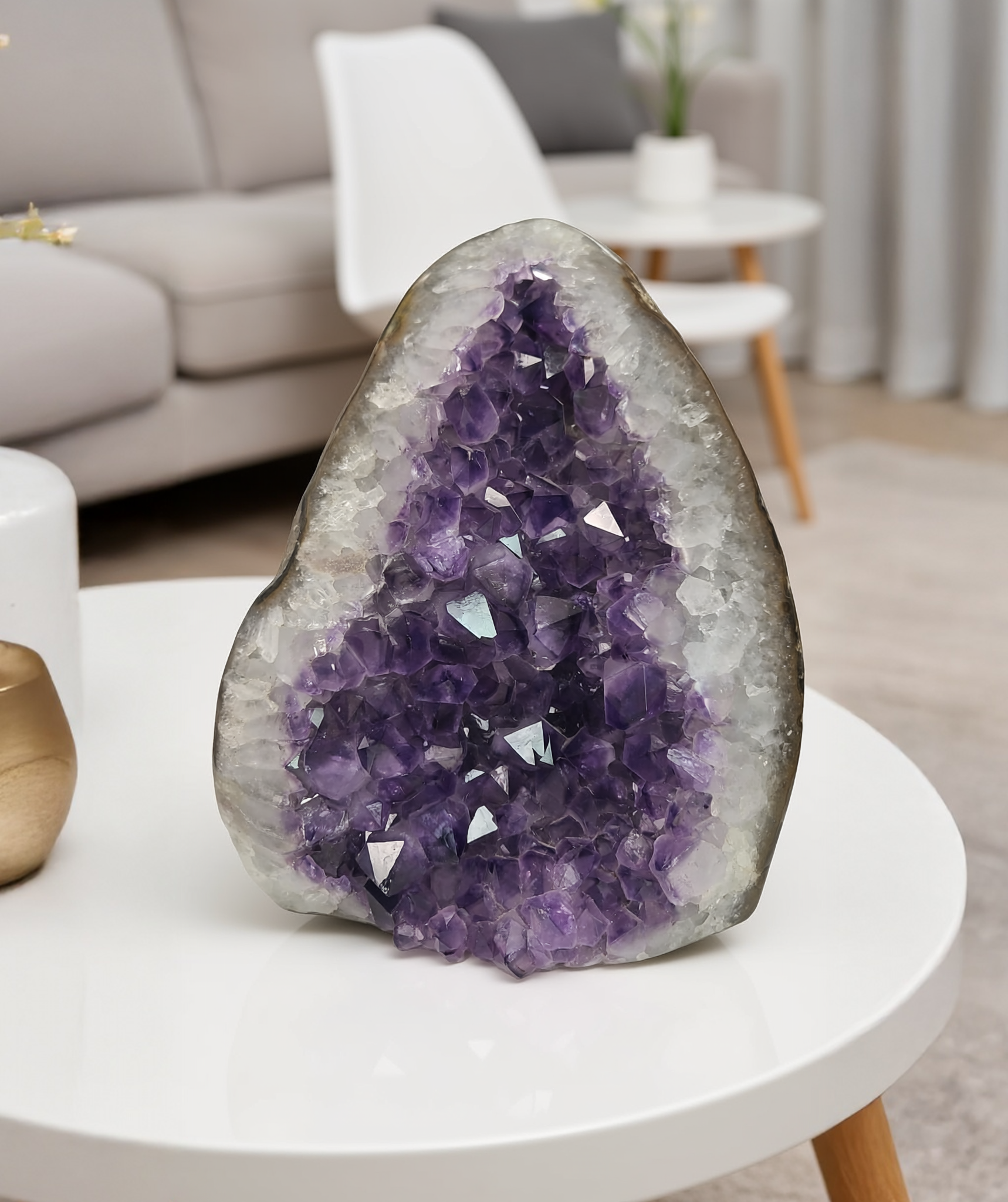 Triangular Uruguayan amethyst geode with deep purple crystal points and clear quartz edges.