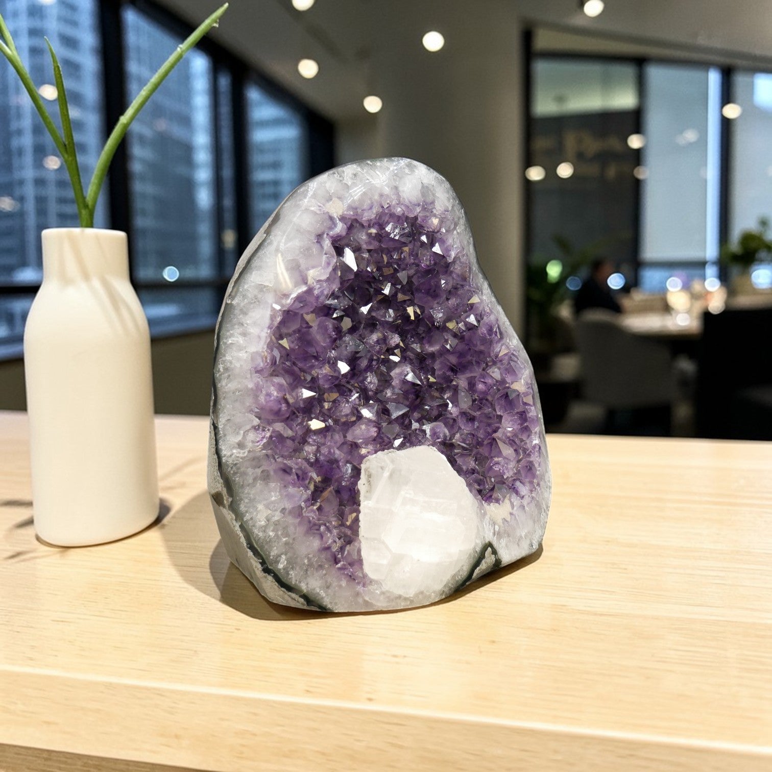 Natural amethyst geode with large white calcite crystal growth inside cavity, dual mineral formation, Artigas Uruguay