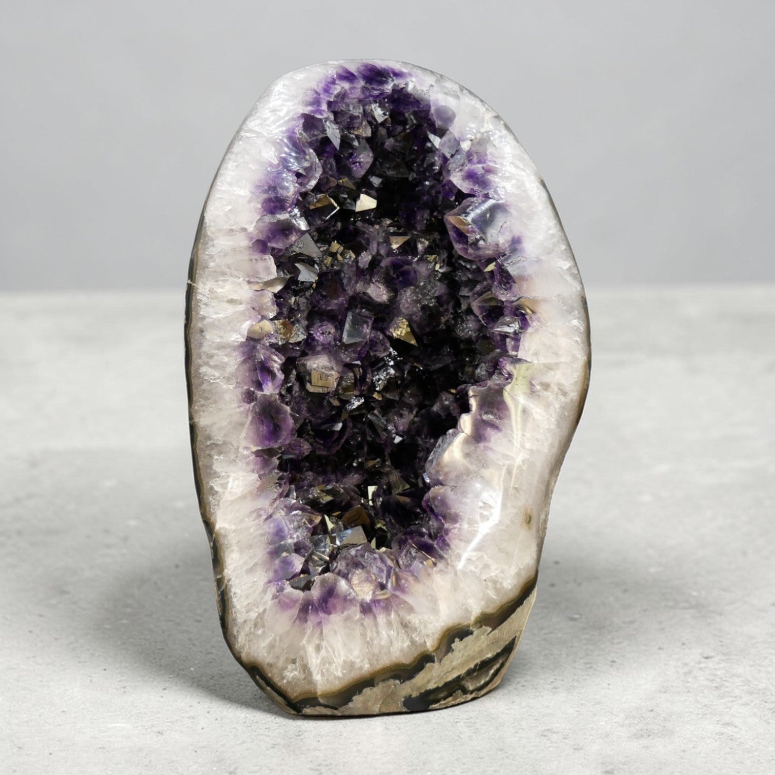 The deep purple saturation is characteristic of Uruguayan amethyst — denser and richer in color than Brazilian material, with tightly packed crystal points that catch and hold light from every angle.