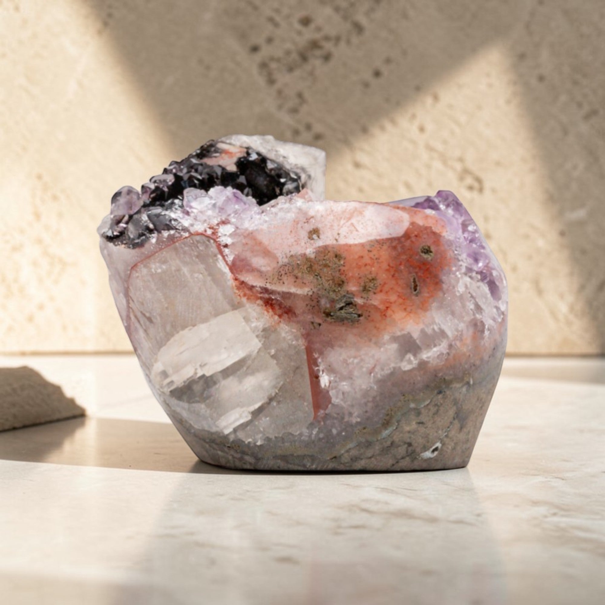 A hand sized crystal shaped by volcanic forces, this mini amethyst geode reveals the quiet drama of deep time