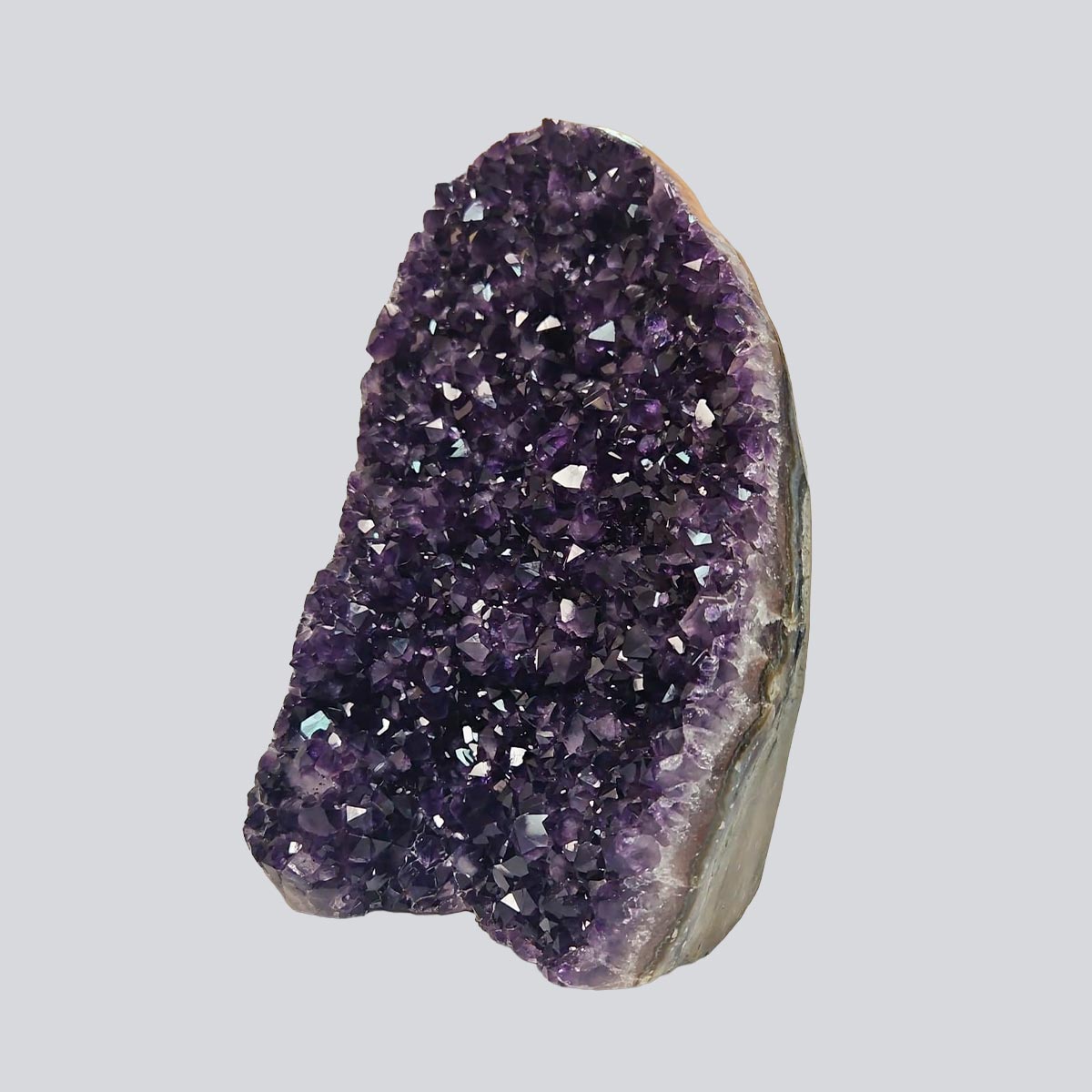 Tall Uruguayan amethyst geode with deep violet crystal points and layered agate banding, measuring 11 inches high by 7 long and 4 wide.