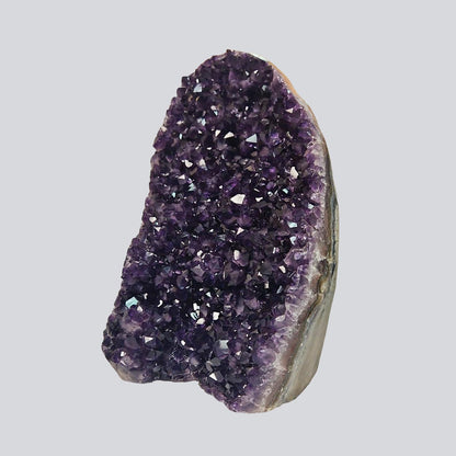 Tall Uruguayan amethyst geode with deep violet crystal points and layered agate banding, measuring 11 inches high by 7 long and 4 wide.