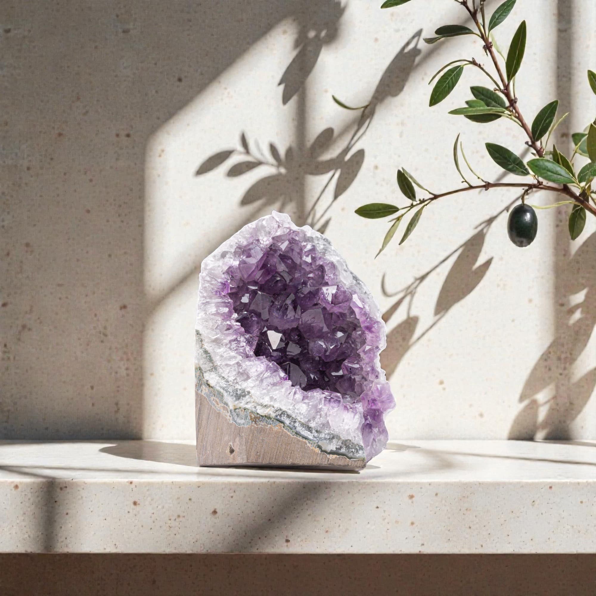 Small premium amethyst cluster displayed on modern desk decor, ideal size for office energy and refined spiritual accent.