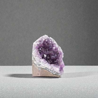 Side view of authentic Uruguay amethyst cluster under 1 lb highlighting dense crystal points and rich violet color.