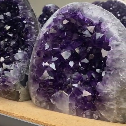 This premium AAA grade Uruguayan amethyst cluster (4-5 lb) carries the glow of natural crystals from Uruguay with exceptional color depth and clarity. Perfect for those looking to buy rare quality amethyst for luxury home decor or serious crystal collections, this museum-grade piece adds elegance and grounding calm to any space